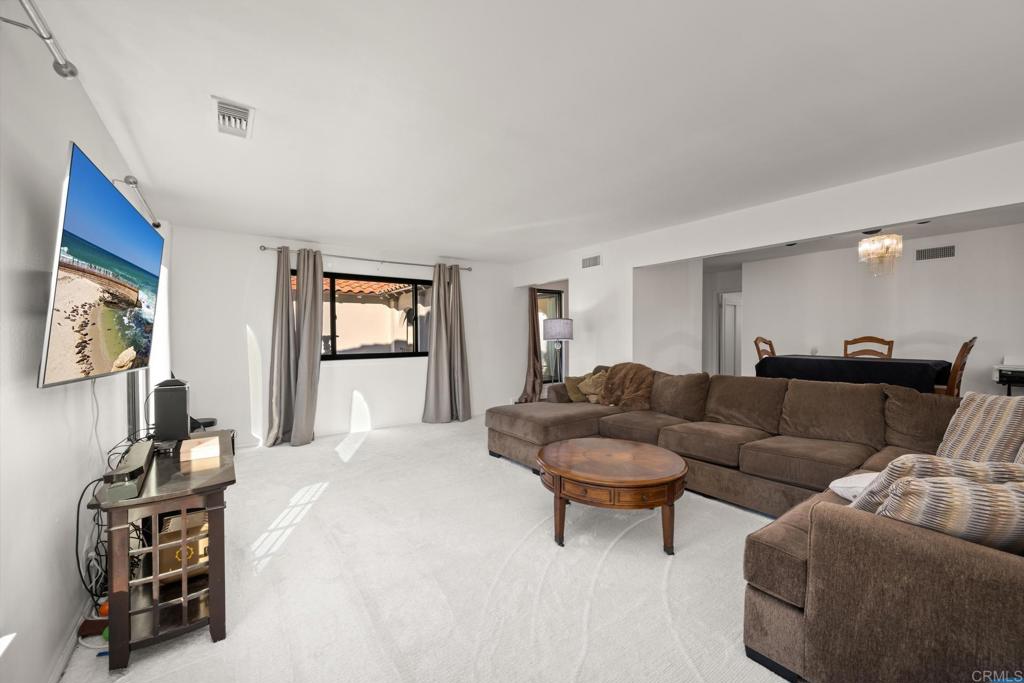 16273 Arena Drive Ramona, CA 92065 - Photo 18 of 67 a living room with furniture a couch and a flat screen tv