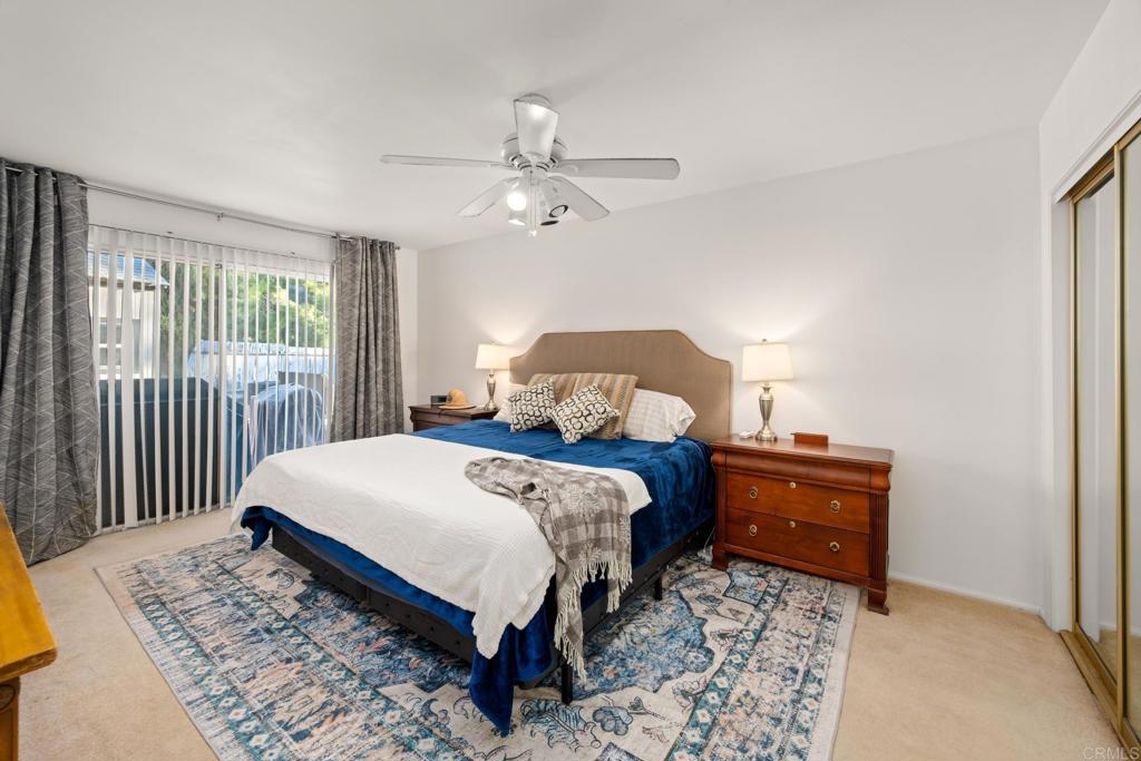 16273 Arena Drive Ramona, CA 92065 - Photo 23 of 67 a bedroom with a bed and wooden floor