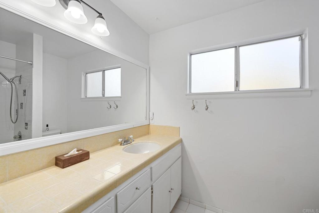 16273 Arena Drive Ramona, CA 92065 - Photo 27 of 67 a bathroom with a sink and a mirror