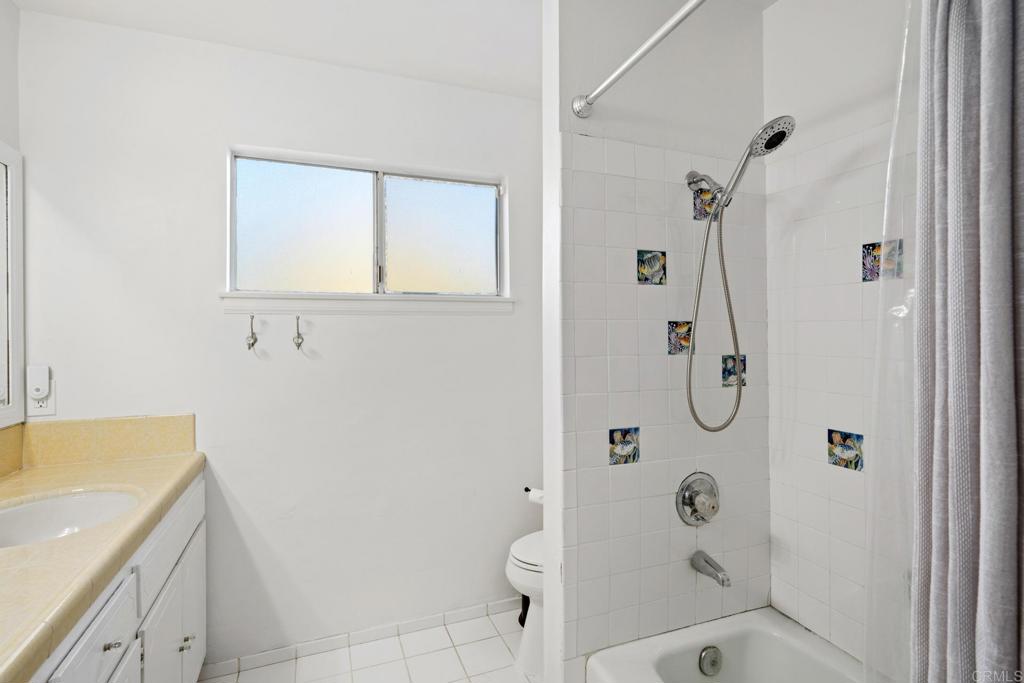 16273 Arena Drive Ramona, CA 92065 - Photo 28 of 67 a bathroom with a shower and a sink