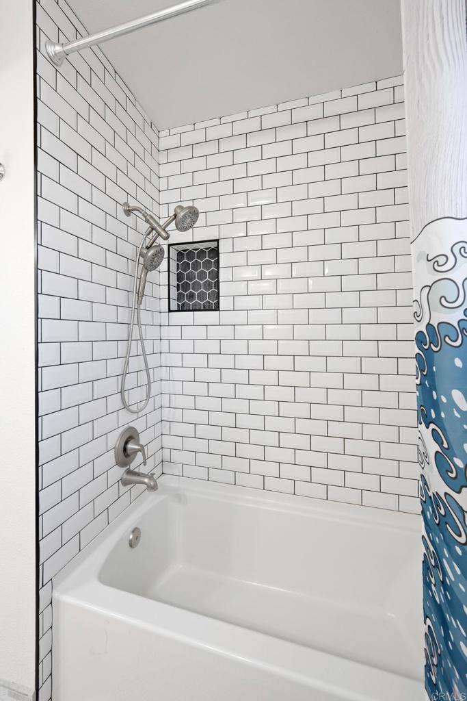 16273 Arena Drive Ramona, CA 92065 - Photo 29 of 67 a bathroom with a bathtub and a shower