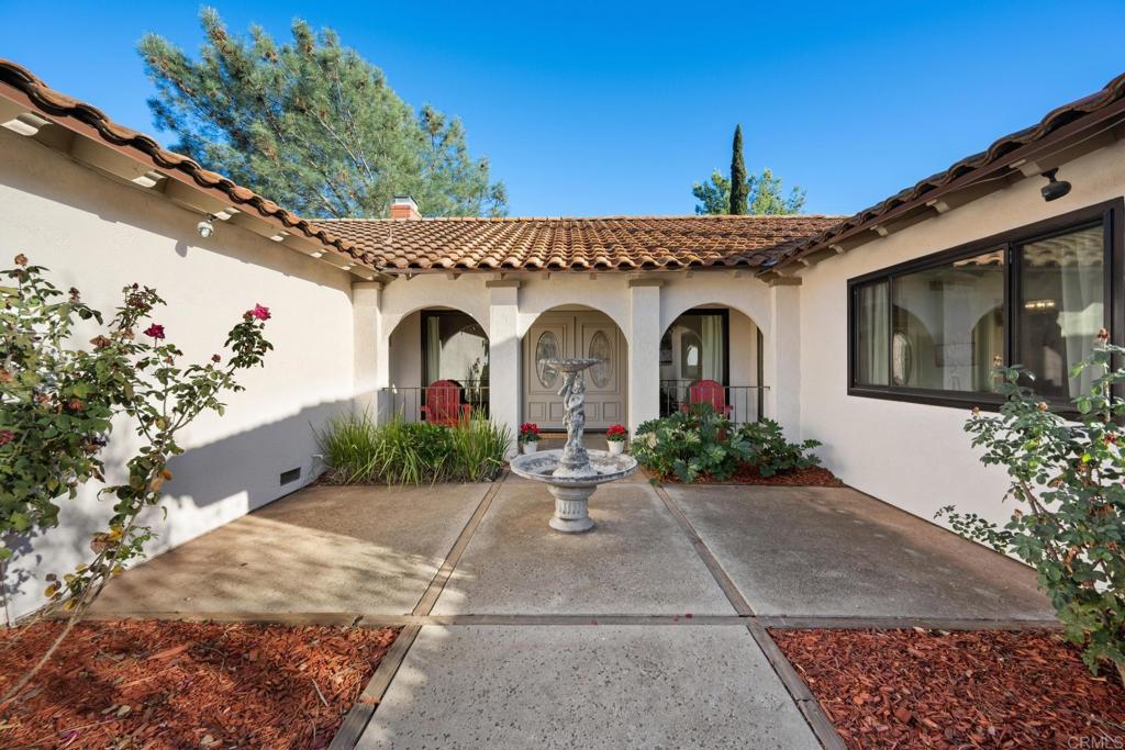 16273 Arena Drive Ramona, CA 92065 - Photo 3 of 67 a front view of a house with garden