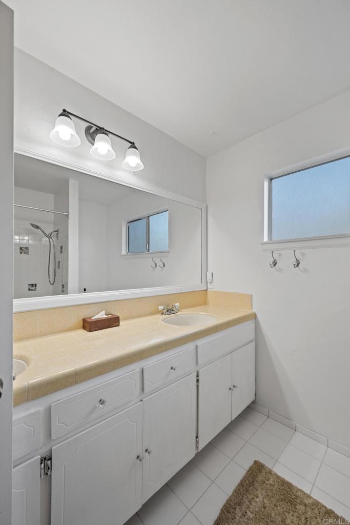 16273 Arena Drive Ramona, CA 92065 - Photo 31 of 67 a bathroom with a sink and a mirror