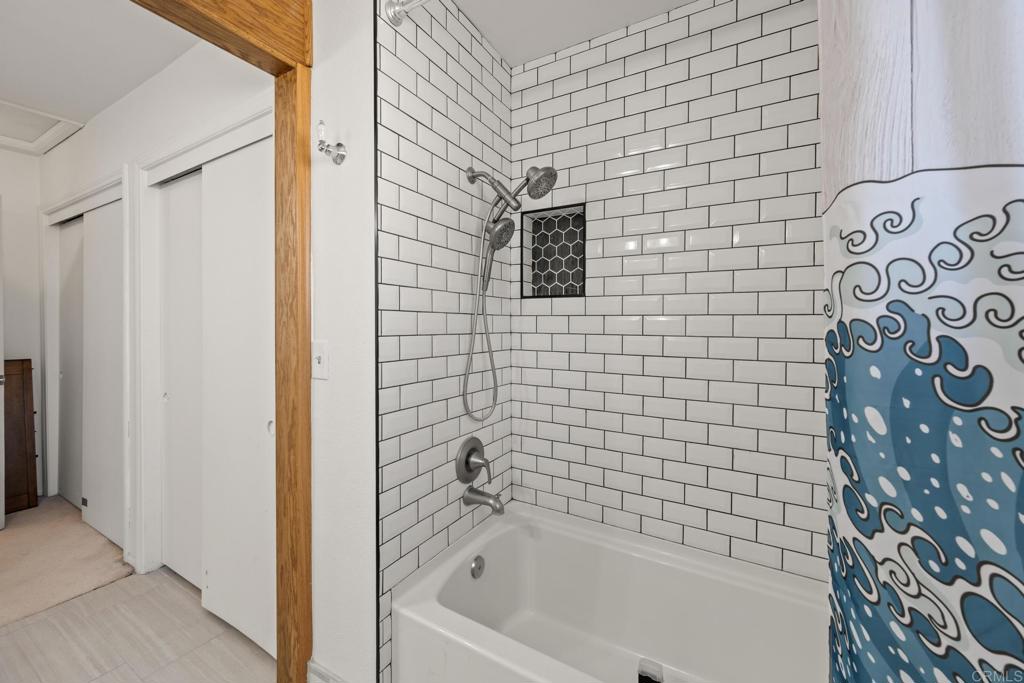 16273 Arena Drive Ramona, CA 92065 - Photo 35 of 67 a bathroom with a bathtub and a shower