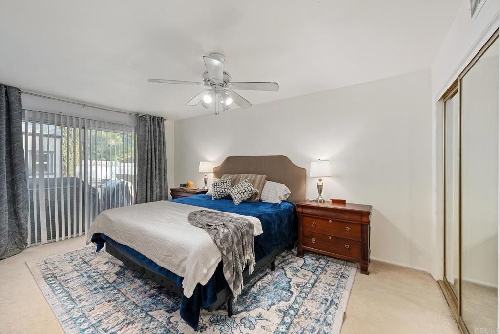 16273 Arena Drive Ramona, CA 92065 - Photo 37 of 67 a bedroom with a bed and a chandelier