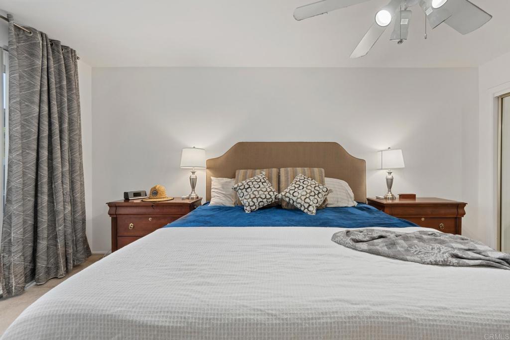 16273 Arena Drive Ramona, CA 92065 - Photo 38 of 67 a bedroom with a bed and wooden floor