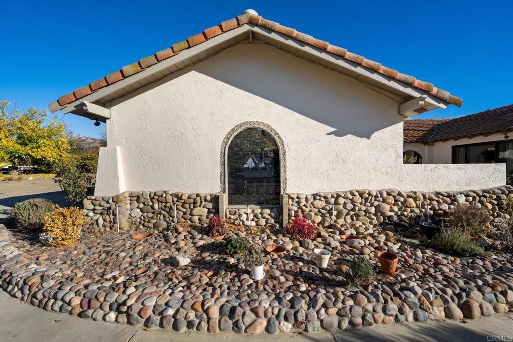 16273 Arena Drive Ramona, CA 92065 - Photo 4 of 67 a front view of a house with a yard