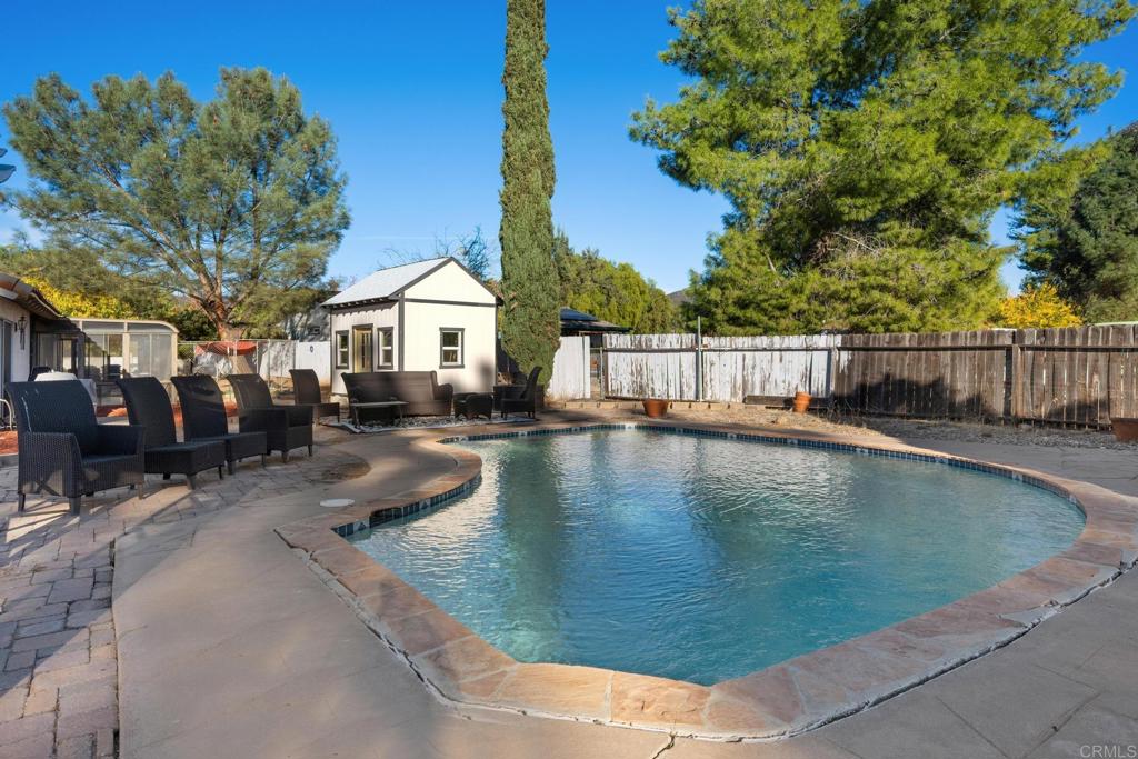 16273 Arena Drive Ramona, CA 92065 - Photo 43 of 67 a view of a swimming pool with a patio
