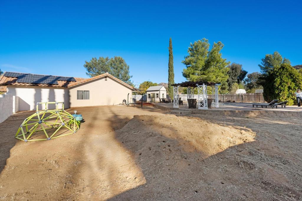 16273 Arena Drive Ramona, CA 92065 - Photo 45 of 67 a view of a swimming pool with a yard