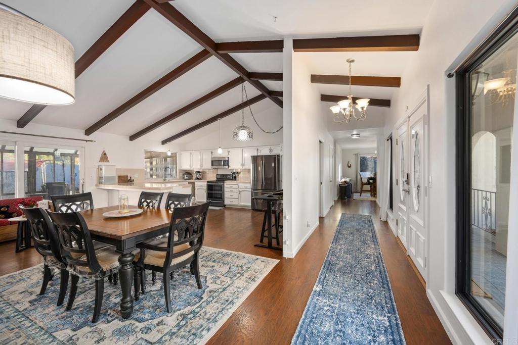 16273 Arena Drive Ramona, CA 92065 - Photo 7 of 67 a dining room with stainless steel appliances granite countertop furniture a table and chairs