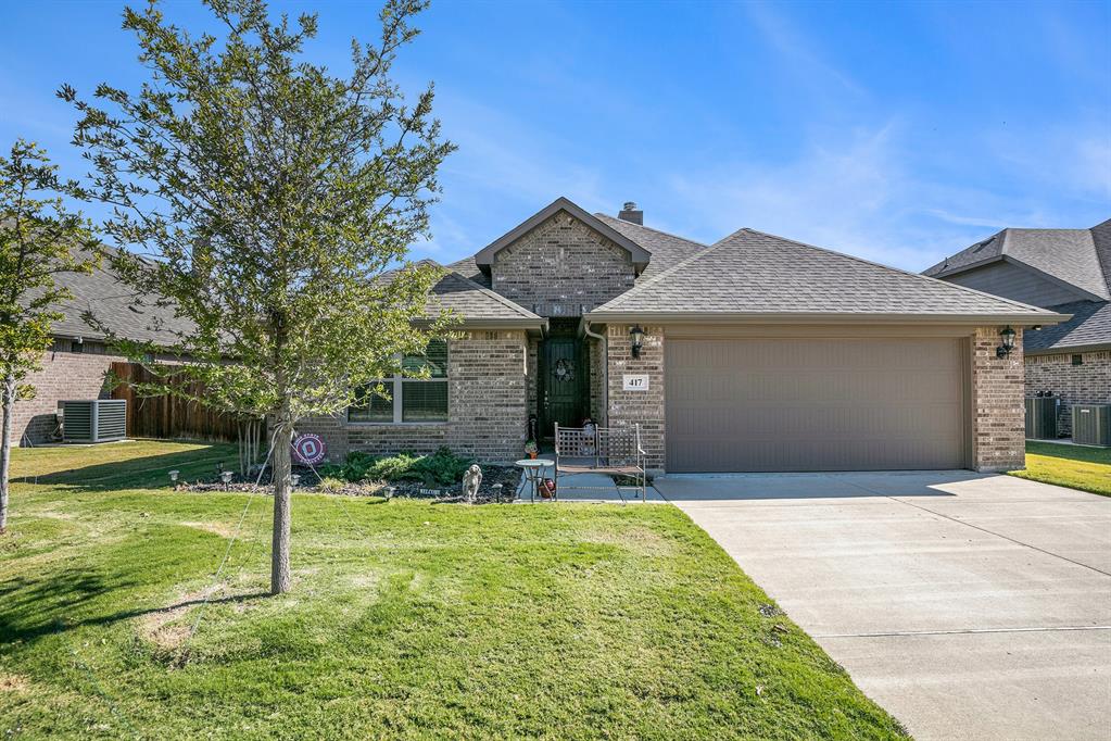 417 Elyse Road Keene, TX 76059 - Photo 1 of 34 a front view of a house with a yard