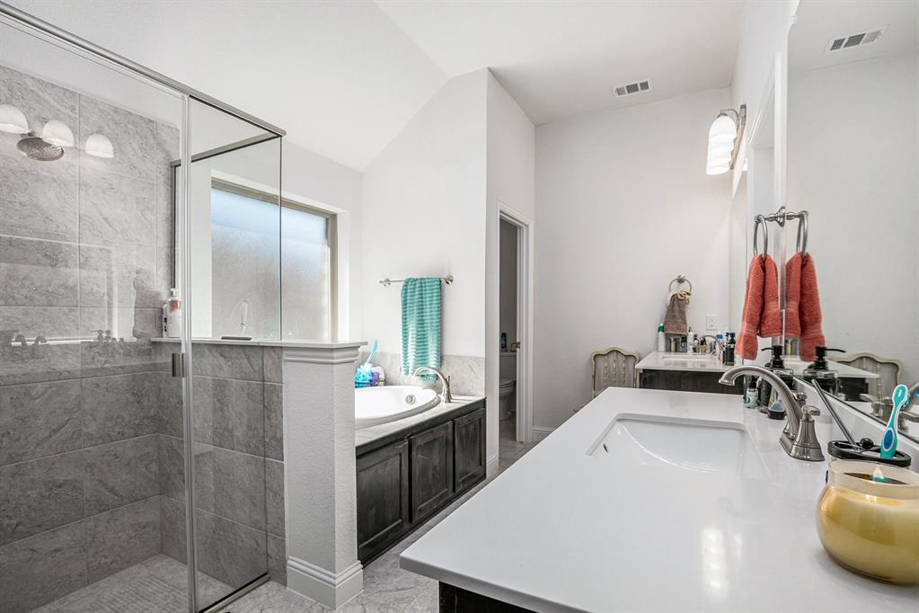 417 Elyse Road Keene, TX 76059 - Photo 12 of 17 a bathroom with a sink and a mirror