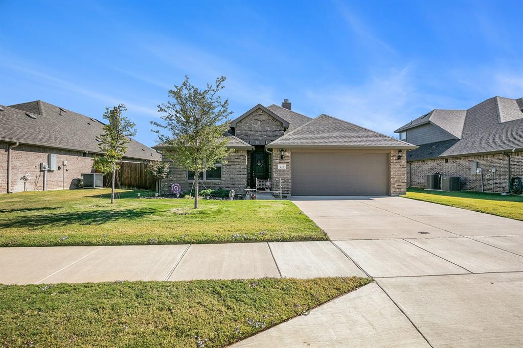 417 Elyse Road Keene, TX 76059 - Photo 2 of 34 a front view of a house with a yard