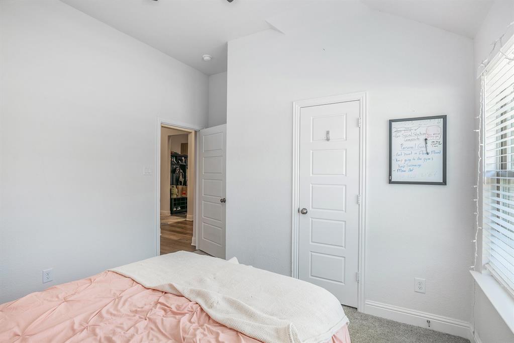 417 Elyse Road Keene, TX 76059 - Photo 25 of 34 a bedroom with a bed and a window