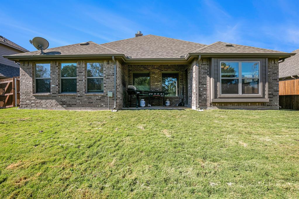 417 Elyse Road Keene, TX 76059 - Photo 34 of 34 a front view of a house with a garden