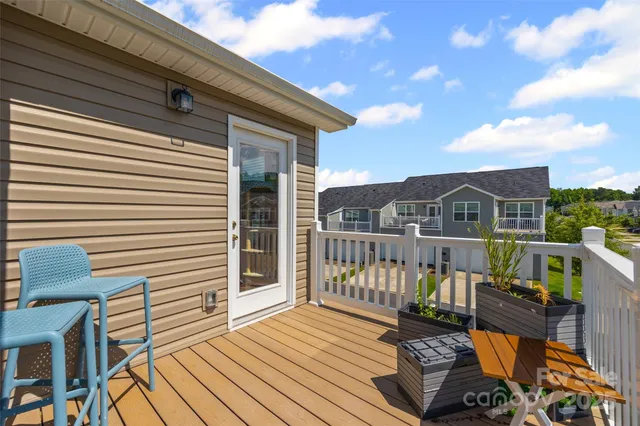 a view of a balcony with wooden floor