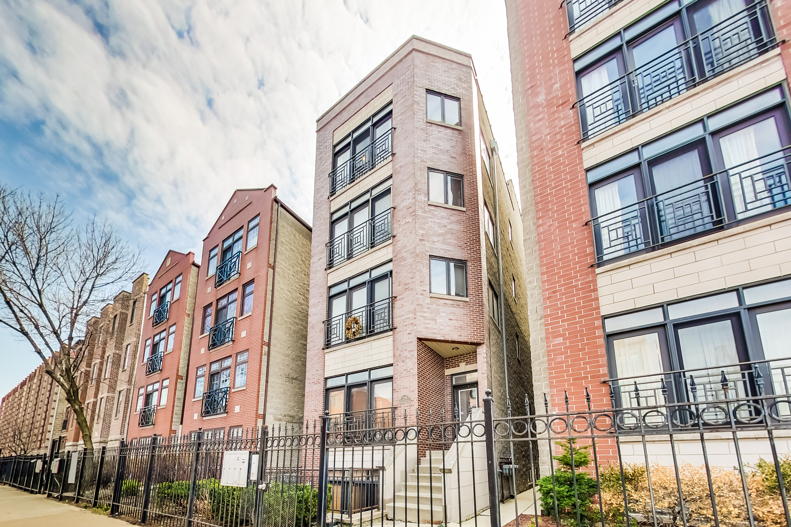2353 West Harrison Street, Unit 4 Chicago, IL 60612 - Photo 1 of 25 a front view of a multi story residential apartment building