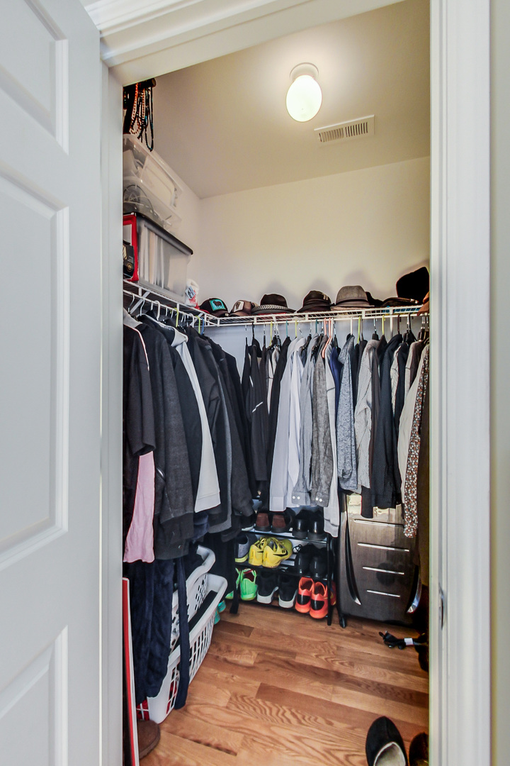 2353 West Harrison Street, Unit 4 Chicago, IL 60612 - Photo 12 of 25 a view of walk in closet with clothes and shoes