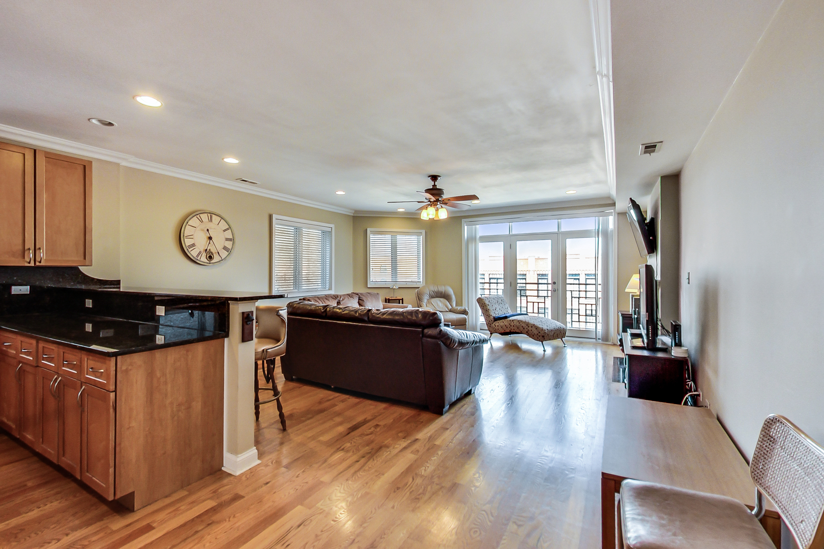 2353 West Harrison Street, Unit 4 Chicago, IL 60612 - Photo 4 of 25 a living room with furniture and wooden floor