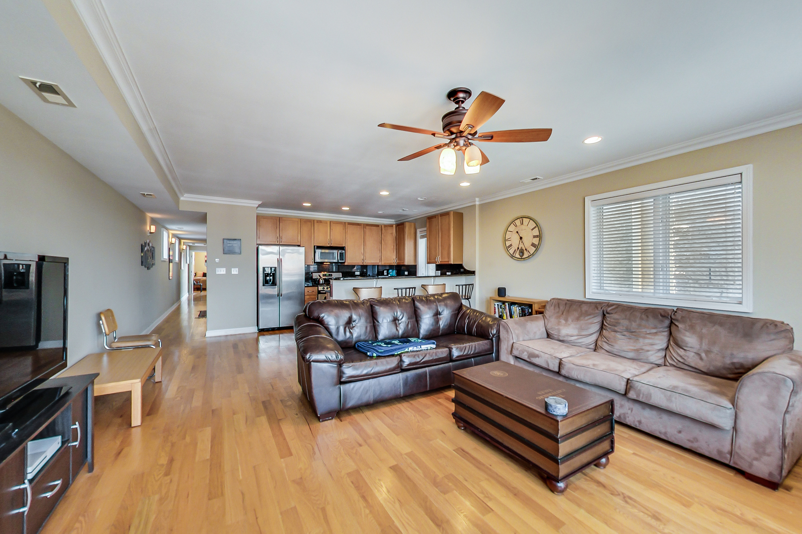 2353 West Harrison Street, Unit 4 Chicago, IL 60612 - Photo 9 of 25 a living room with furniture and a flat screen tv