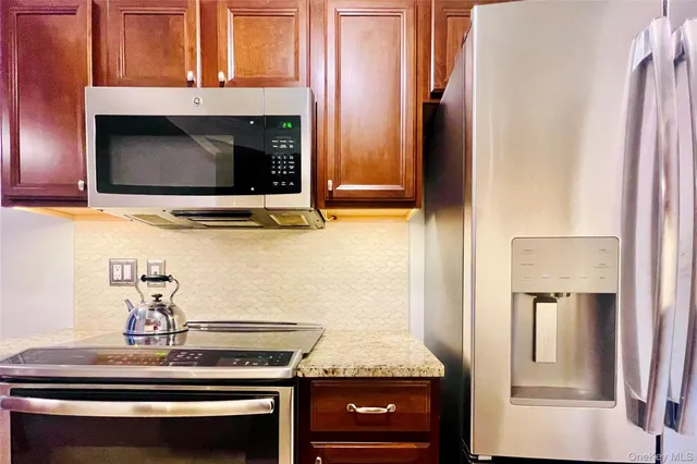 a kitchen with a stove and a microwave