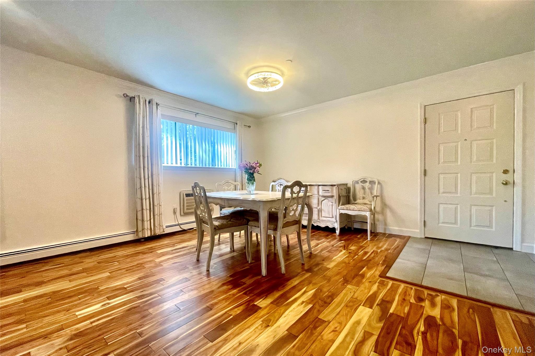 50 Dekalb Avenue, Unit S1 White Plains, NY 10605 - Photo 18 of 28 a view of a dining room with furniture and wooden floor