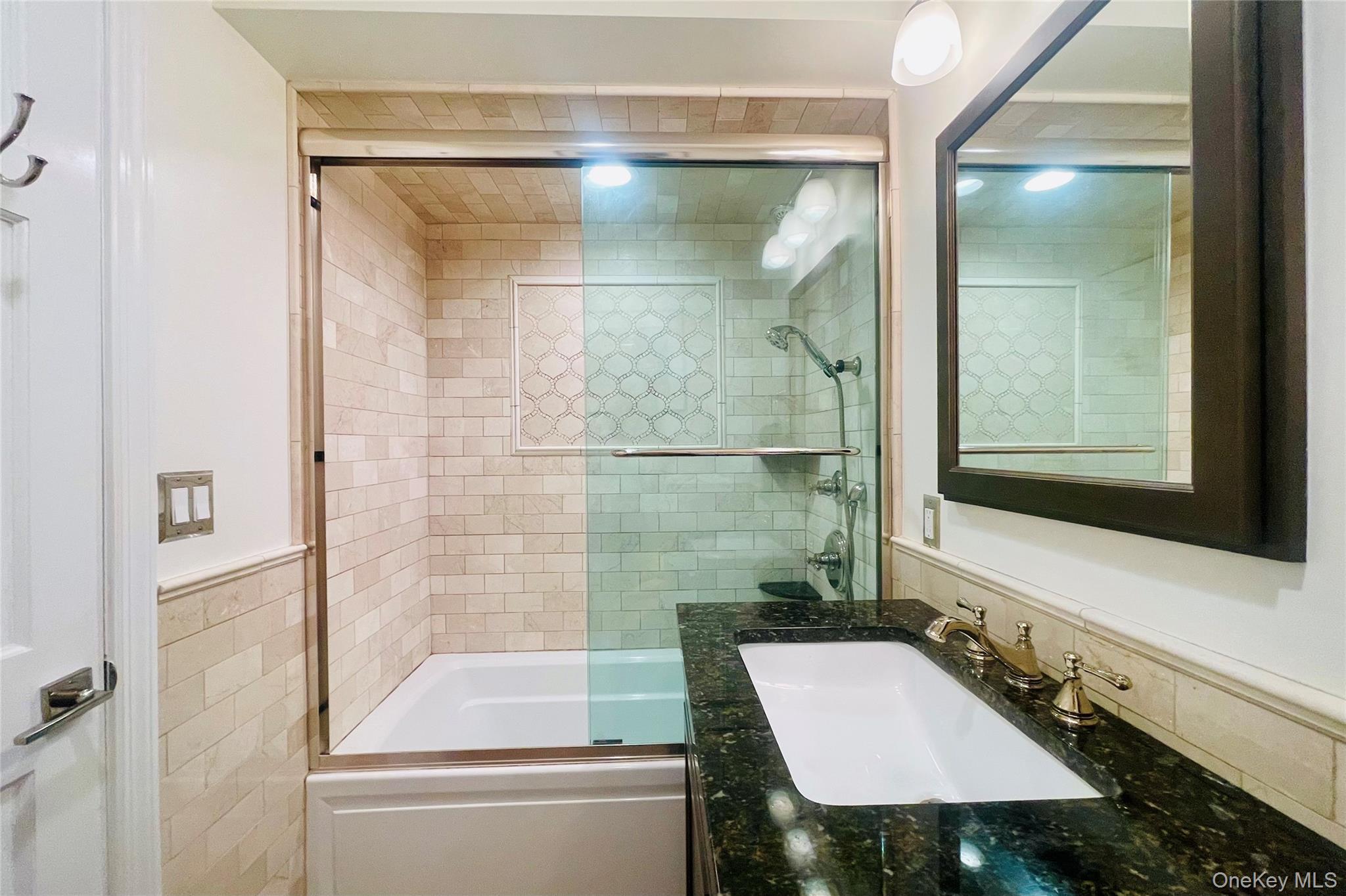 50 Dekalb Avenue, Unit S1 White Plains, NY 10605 - Photo 20 of 28 a bathroom with a sink and a mirror