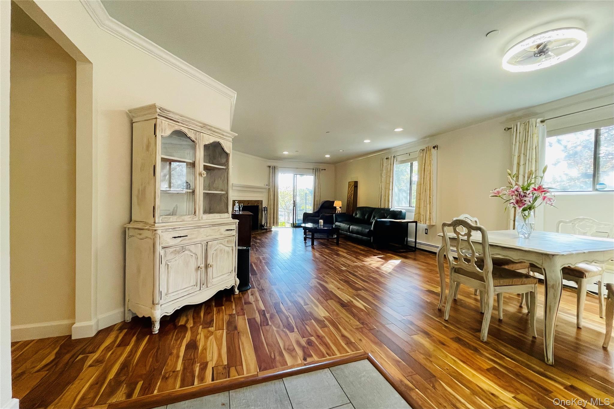 50 Dekalb Avenue, Unit S1 White Plains, NY 10605 - Photo 2 of 28 a living room with furniture a wooden floor and next to a window