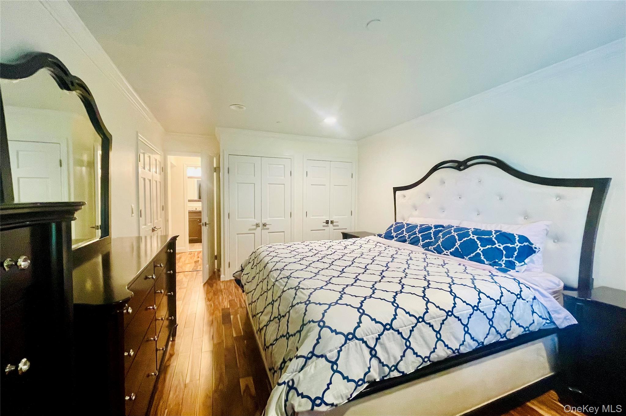 50 Dekalb Avenue, Unit S1 White Plains, NY 10605 - Photo 22 of 28 a bedroom with a bed and a night stand