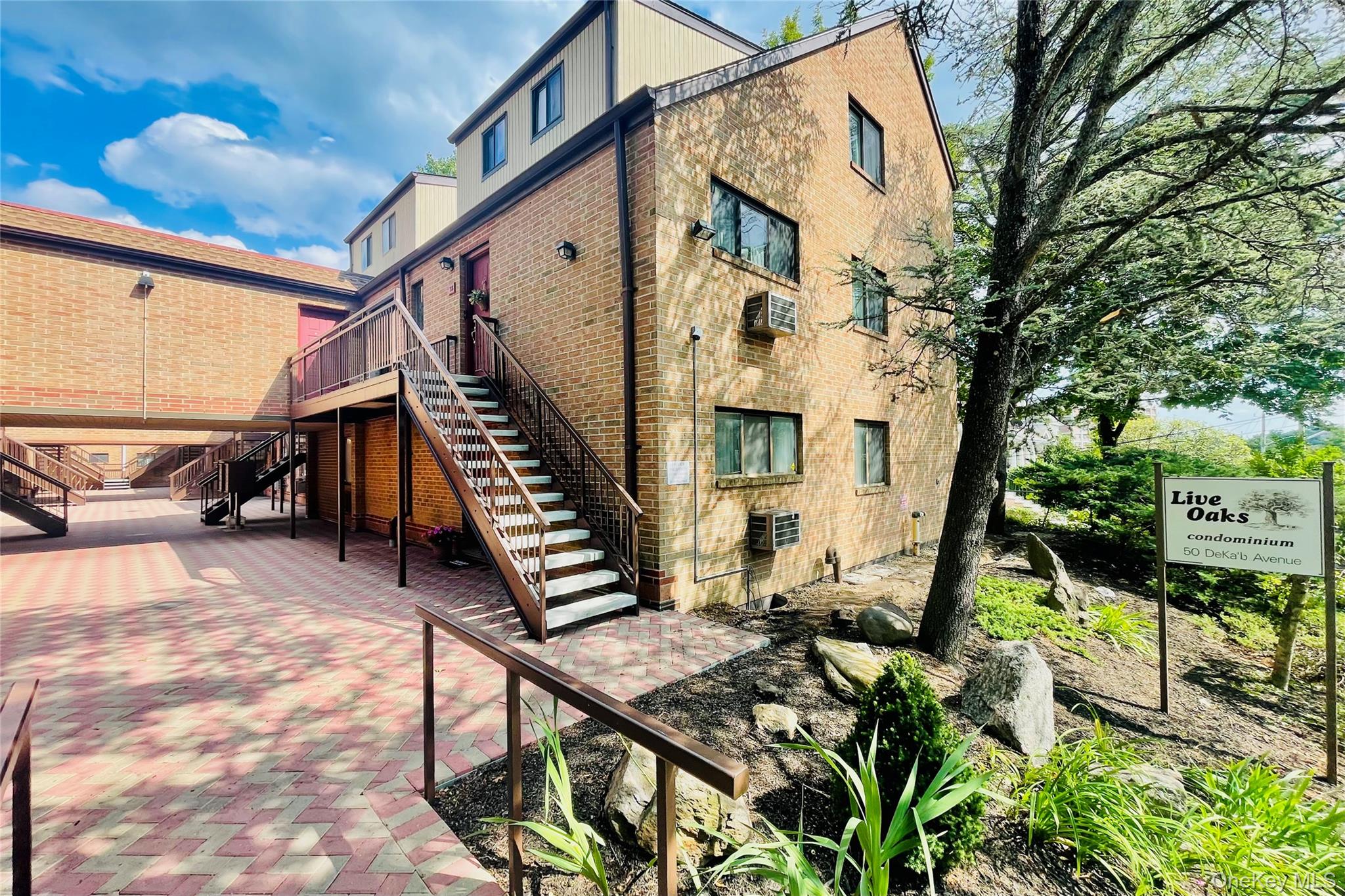 50 Dekalb Avenue, Unit S1 White Plains, NY 10605 - Photo 26 of 28 a view of an house with backyard and furniture