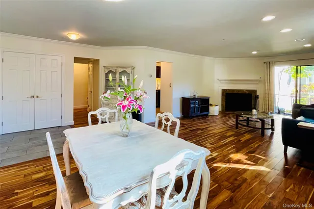 a view of a dining room with furniture and a fireplace