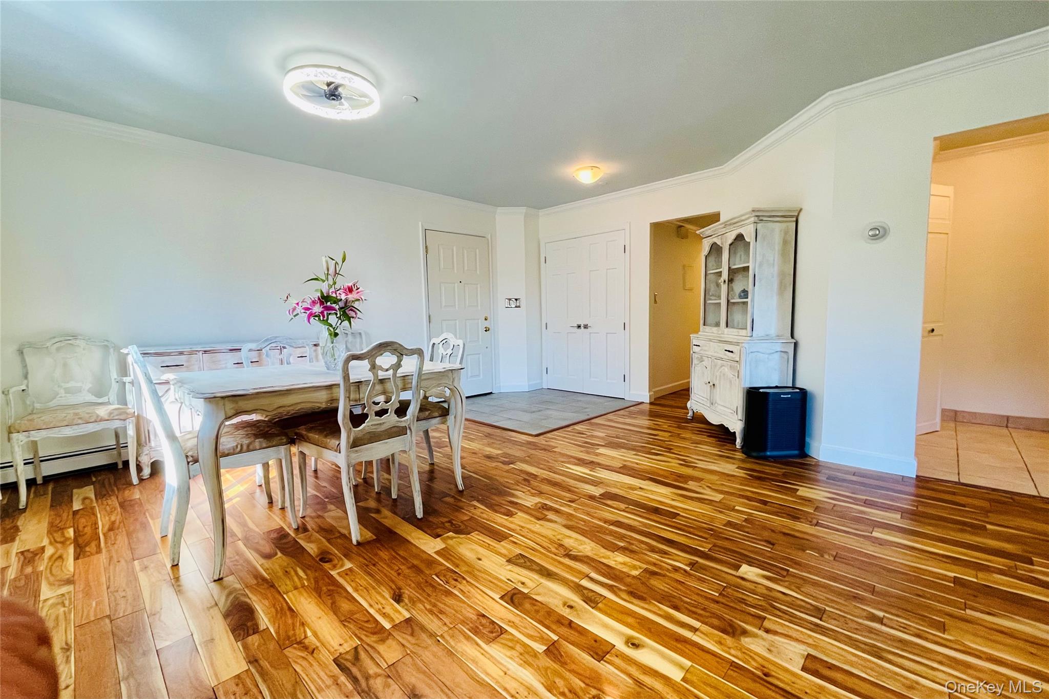 50 Dekalb Avenue, Unit S1 White Plains, NY 10605 - Photo 9 of 28 a dining room with furniture and wooden floor
