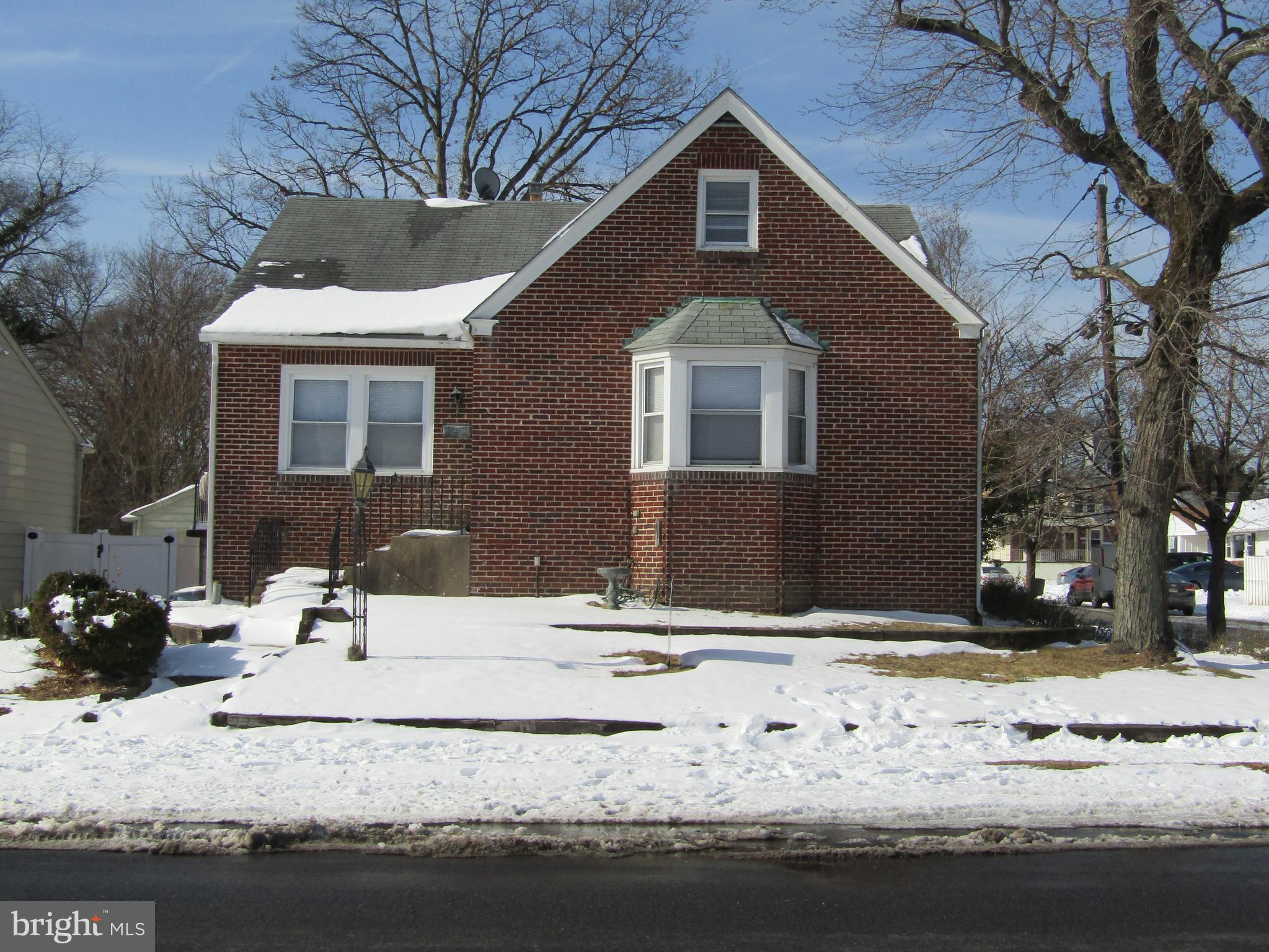a front view of a house with snow