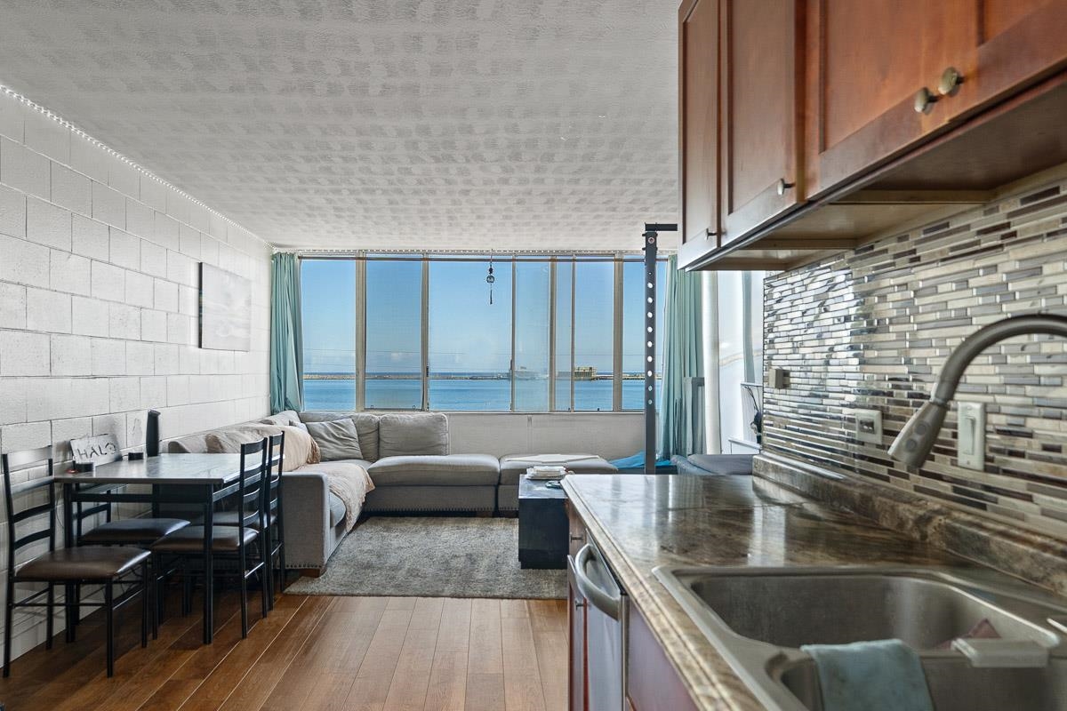 111 Kahului Beach Road, Unit A326 Kahului, HI 96732 - Photo 13 of 43 a kitchen with granite countertop a sink and a counter top space