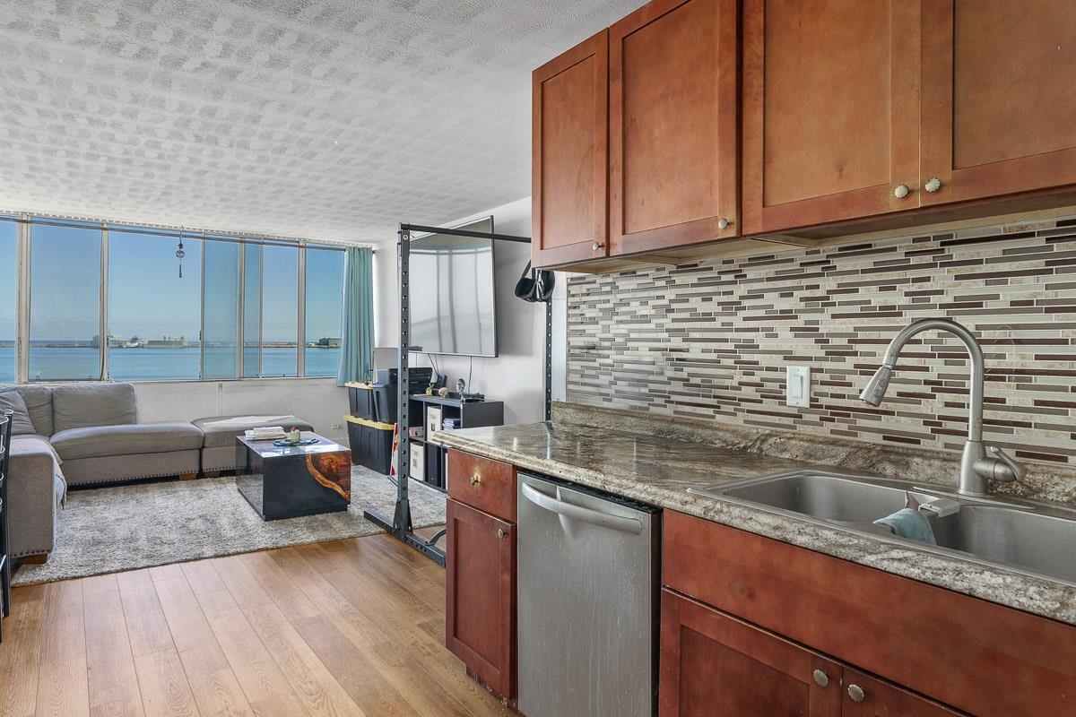 111 Kahului Beach Road, Unit A326 Kahului, HI 96732 - Photo 14 of 43 a kitchen with a sink cabinets and wooden floor