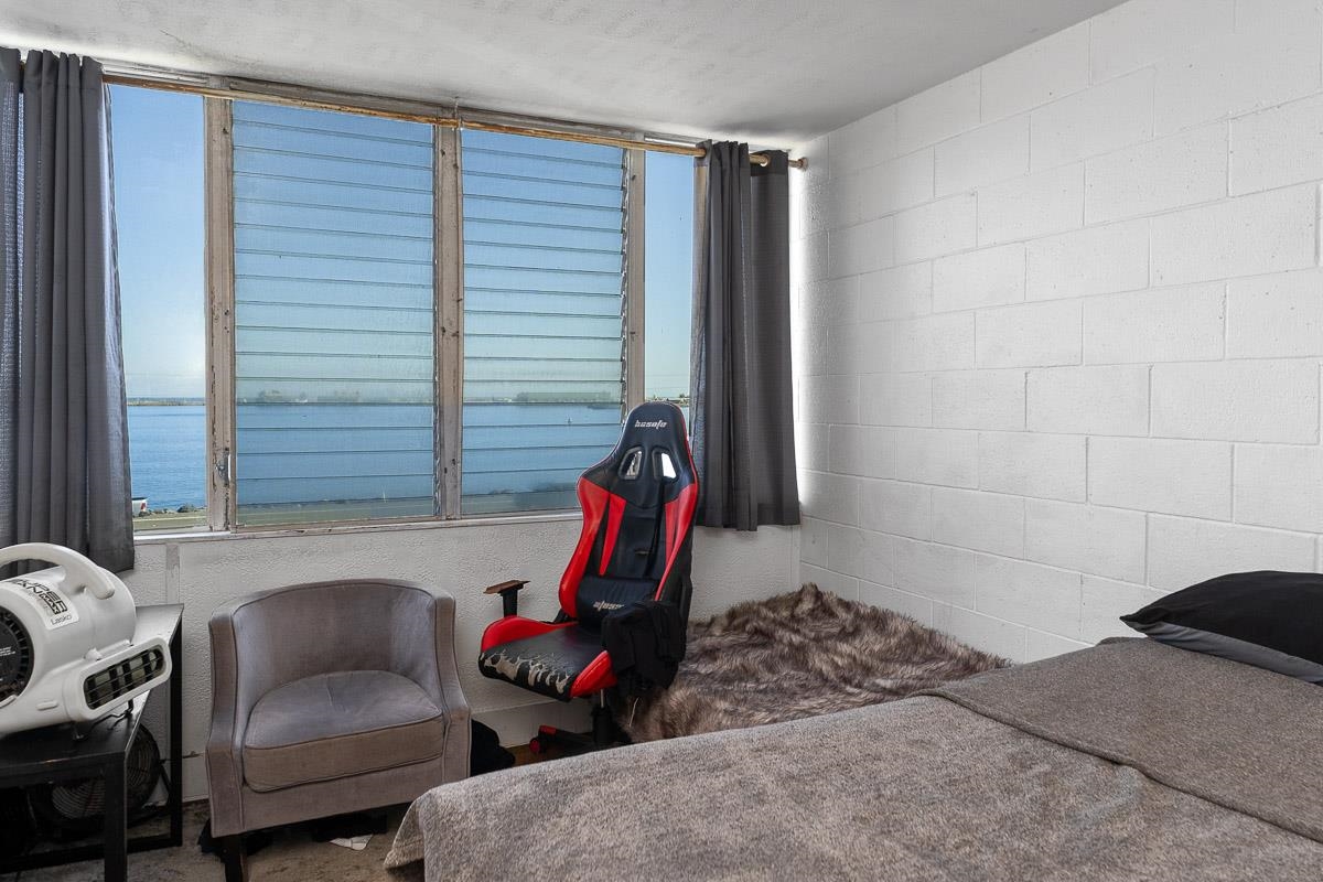 111 Kahului Beach Road, Unit A326 Kahului, HI 96732 - Photo 18 of 43 a bedroom with furniture and a window