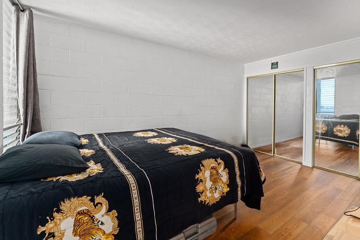 111 Kahului Beach Road, Unit A326 Kahului, HI 96732 - Photo 23 of 43 a bedroom with a bed and a painting on the wall