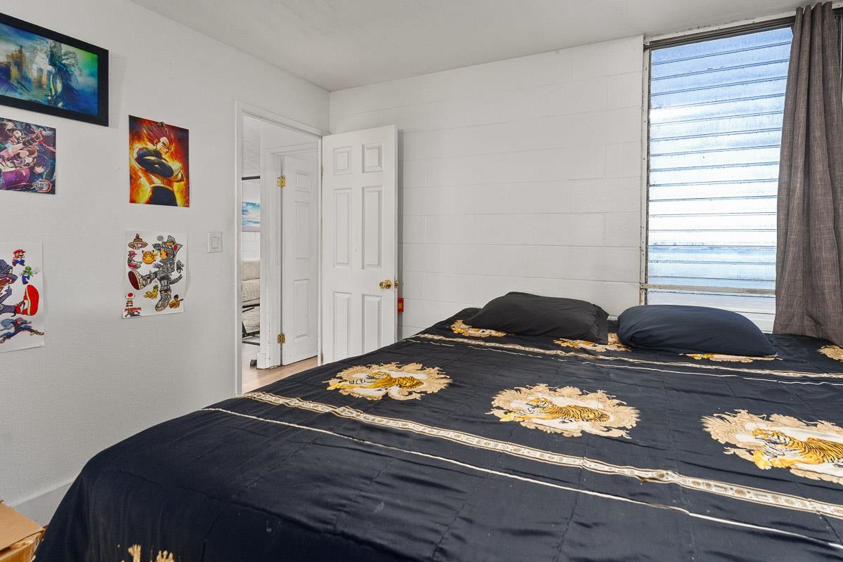 111 Kahului Beach Road, Unit A326 Kahului, HI 96732 - Photo 25 of 43 a bedroom with a bed and cabinets