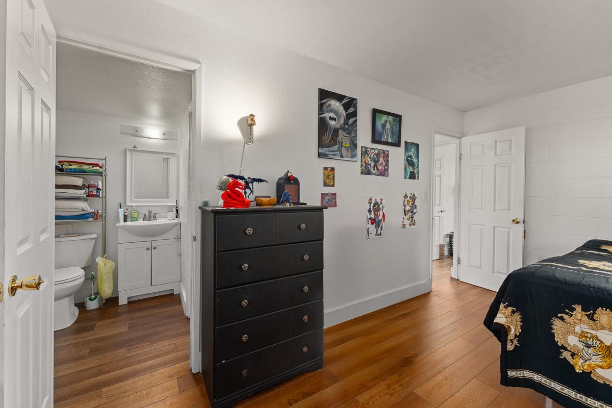 111 Kahului Beach Road, Unit A326 Kahului, HI 96732 - Photo 27 of 43 a bedroom with a bed and wooden floor