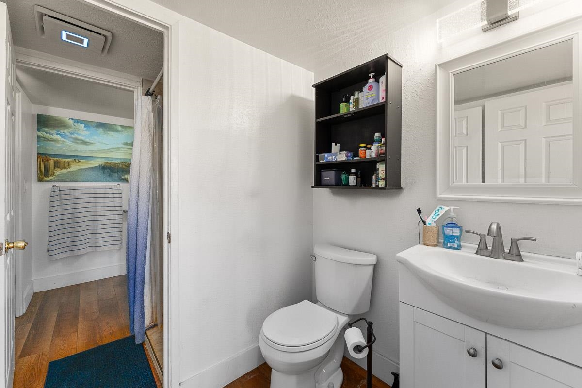 111 Kahului Beach Road, Unit A326 Kahului, HI 96732 - Photo 29 of 43 a bathroom with a toilet a sink and a mirror