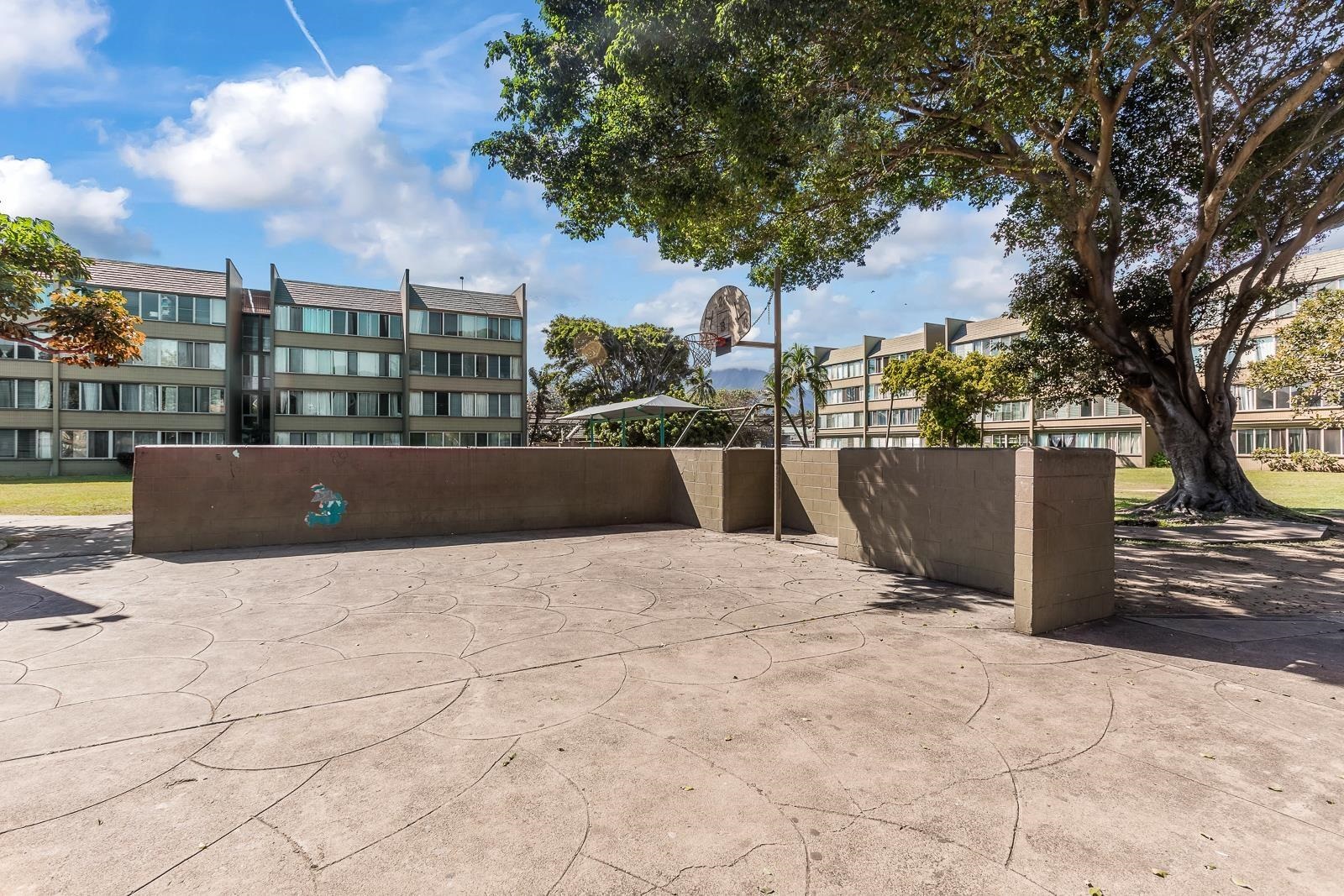 111 Kahului Beach Road, Unit A326 Kahului, HI 96732 - Photo 41 of 43 a view of terrace with wooden fence and large trees