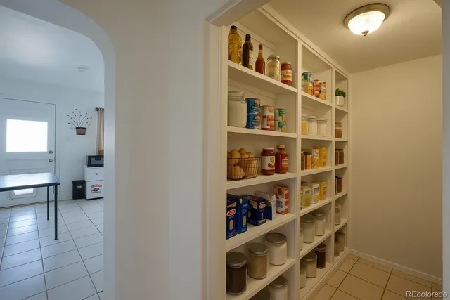 a view of a livingroom with shelves