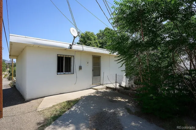 a front view of a house with a garage