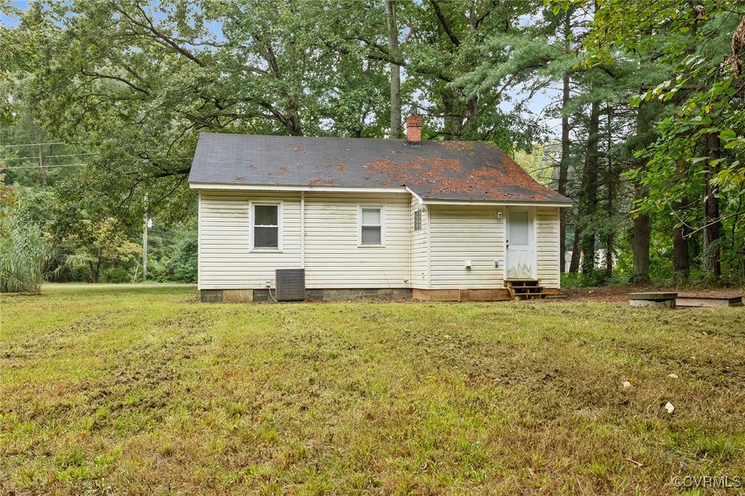 16447 Bullfield Road Doswell, VA 23047 - Photo 19 of 23 Rear view of house featuring central AC unit and a