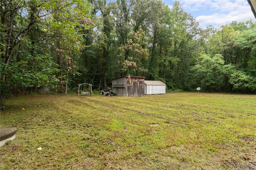 16447 Bullfield Road Doswell, VA 23047 - Photo 22 of 23 View of yard with a storage unit