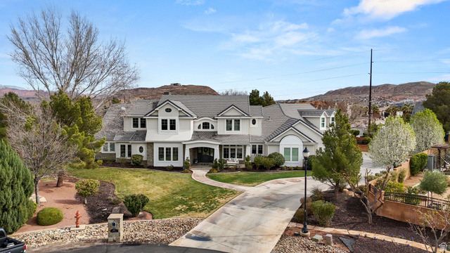 2917 Old Farm Road Washington, UT 84780 - Photo 11 of 105 View of front facade with a mountain view, a front lawn, and concrete driveway