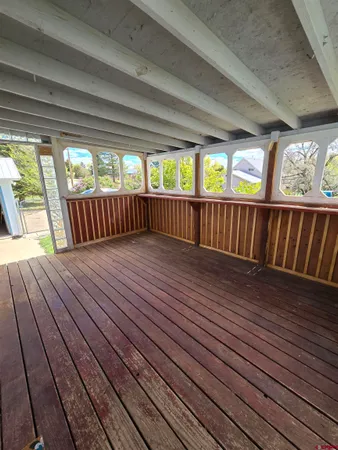 a view of balcony with wooden floor