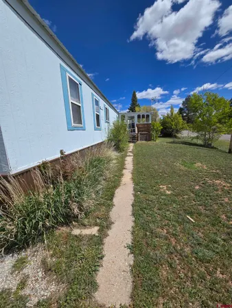 a view of a house with a yard