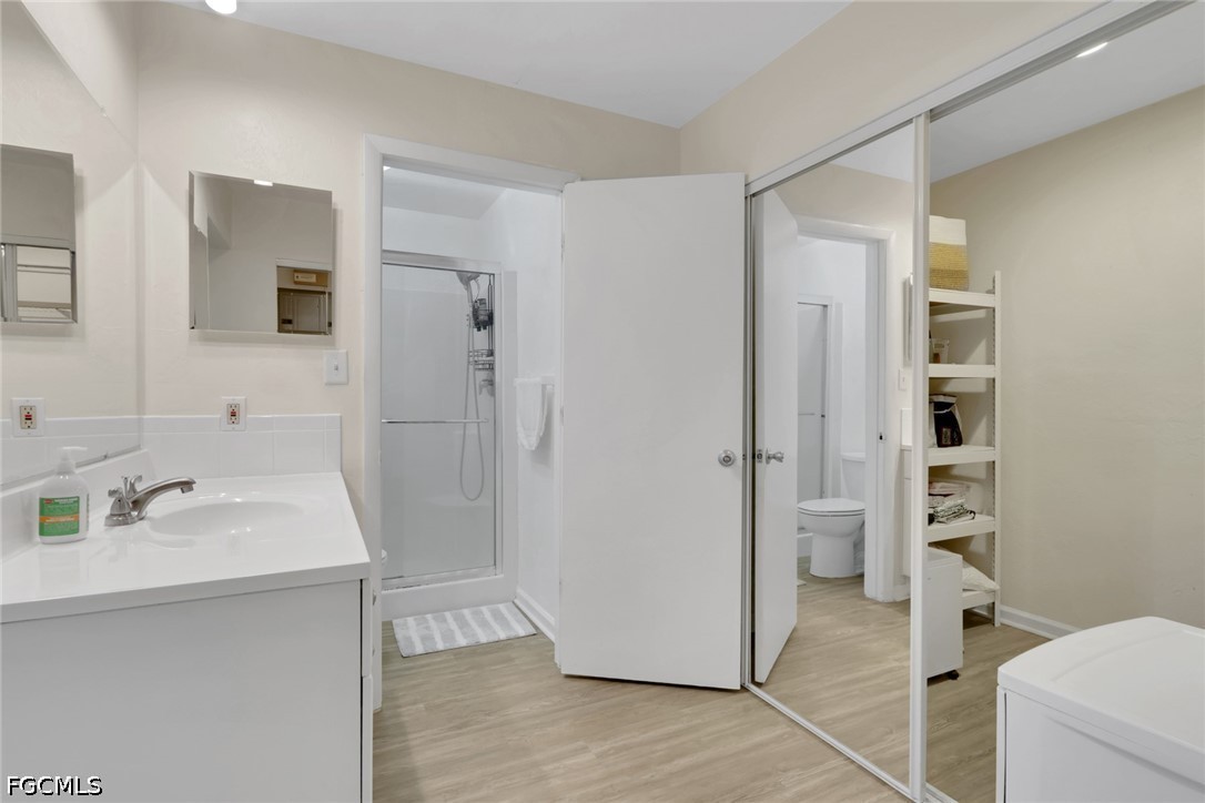 2431 Lippincott Road Alva, FL 33920 - Photo 23 of 43 a bathroom with a sink a toilet and shower