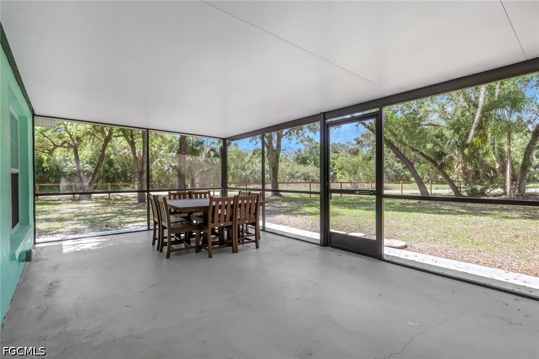 2431 Lippincott Road Alva, FL 33920 - Photo 30 of 43 a view of a floor to ceiling window and a table in the room